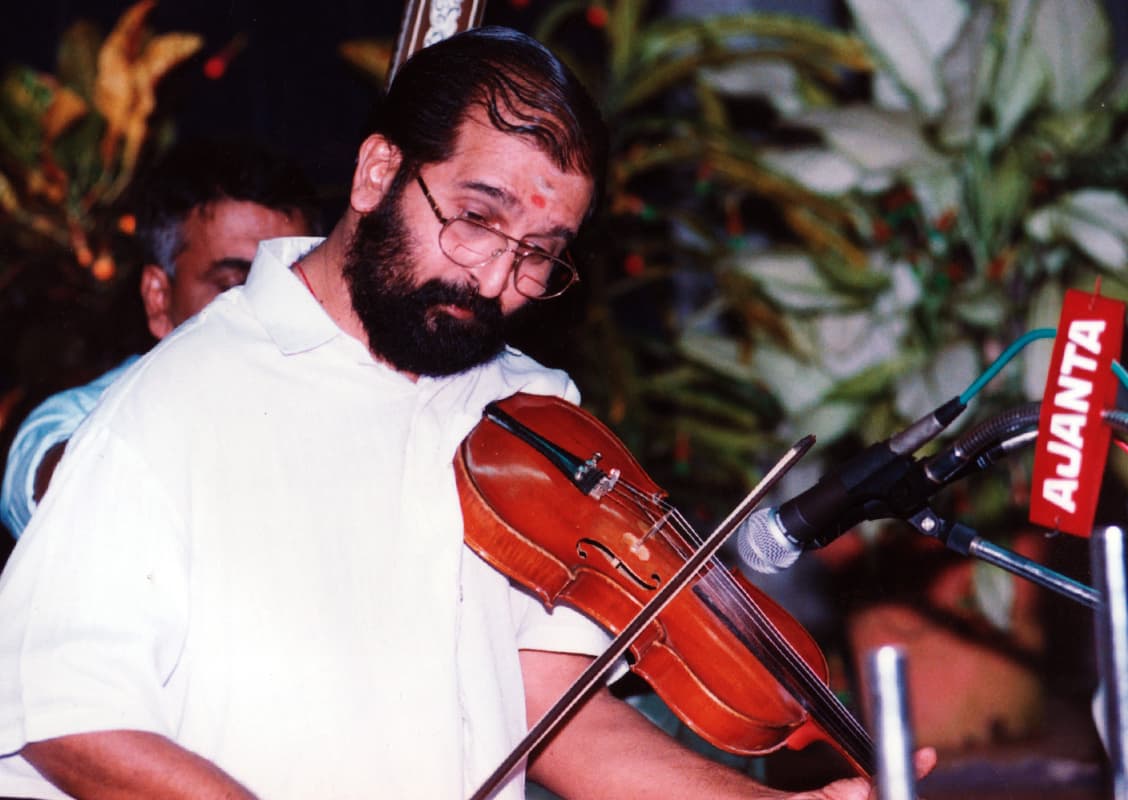B. Sasikumar performing with violin